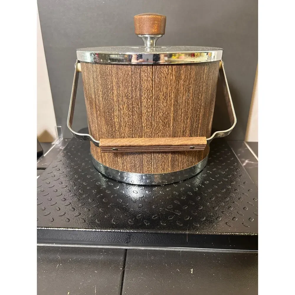 vintage Mid-Century Modern Kromex ice bucket featuring a faux wood grain body